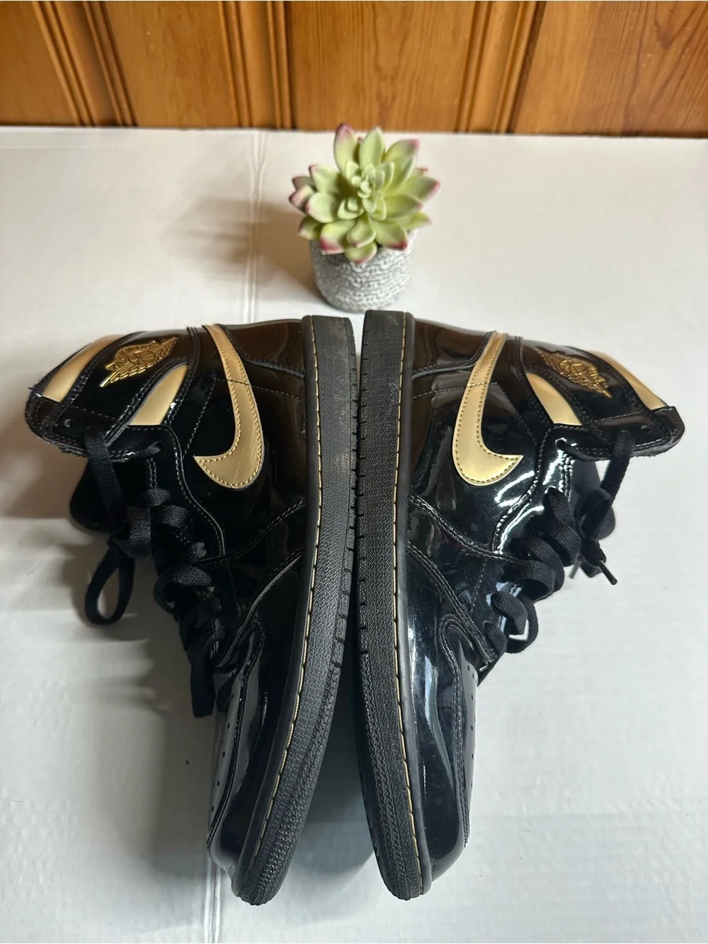 Nike Air High-Top Sneakers in Black with Gold Logo
